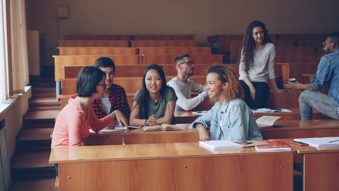 Students talking and studying in a lecture hall